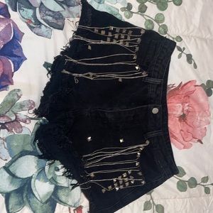 SHEIN size large 40/41 black jean shorts with chain jewelry.
